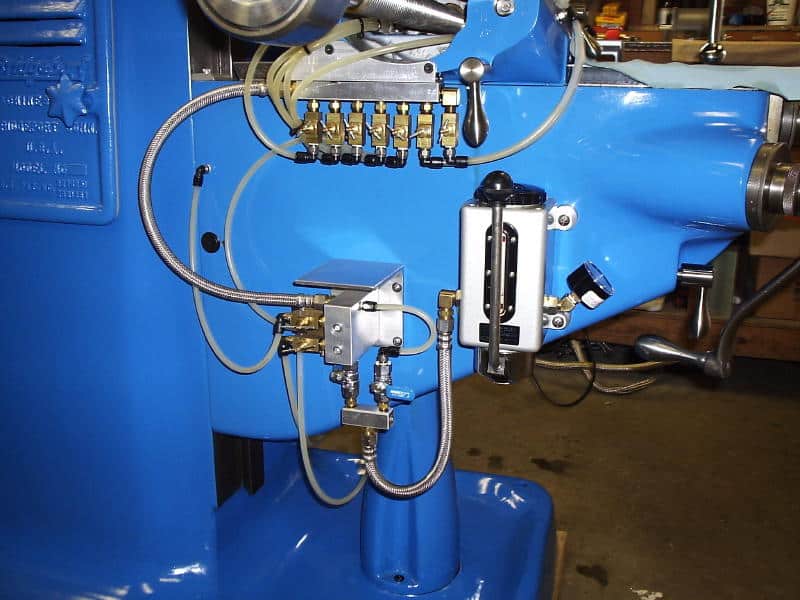 Machining equipment on a dark workshop background.