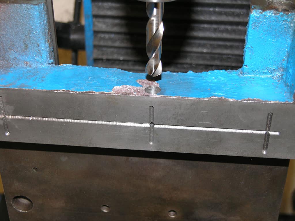 Metalworking setup with drill bit or end mill on machinery.