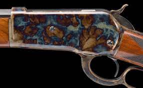 Dark wood grain rifle stock with subtle sheen.