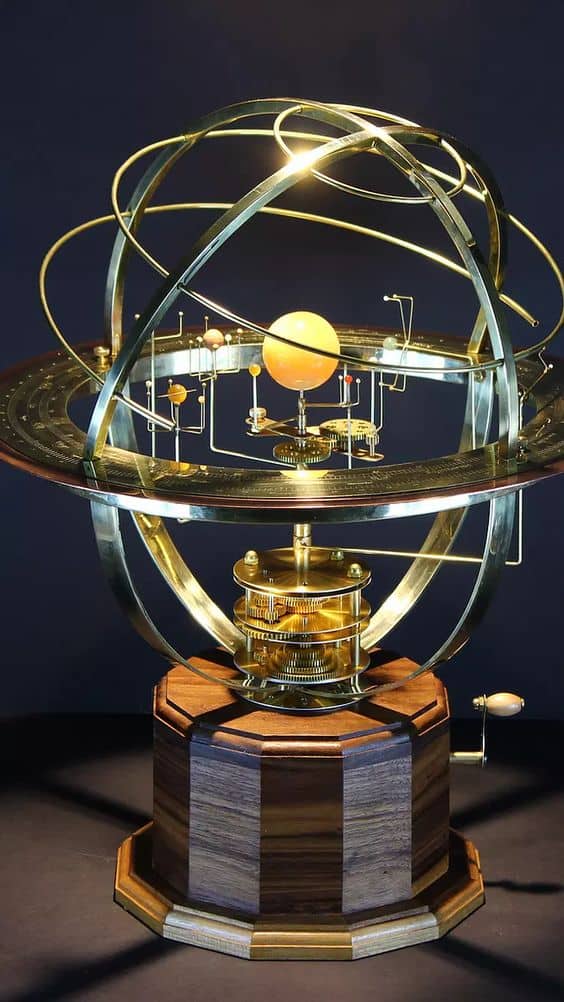 Mechanical orrery model with brass finish and detailed astronomical instruments, showcasing celestial bodies in their relative positions.