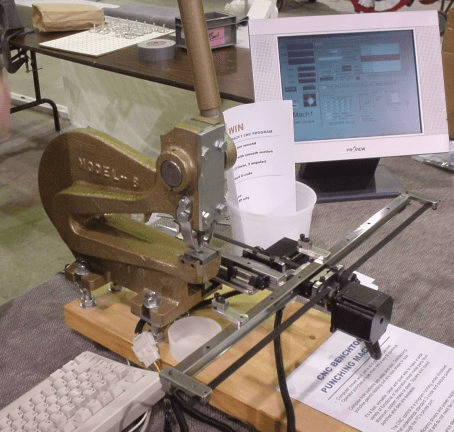 Desktop computer with monitor showing CNCCookbook.com website.