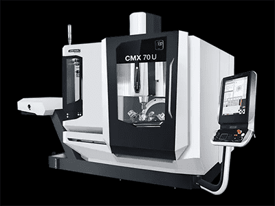 Large white and black CNC machining equipment, flatbed scanner and screen visible.