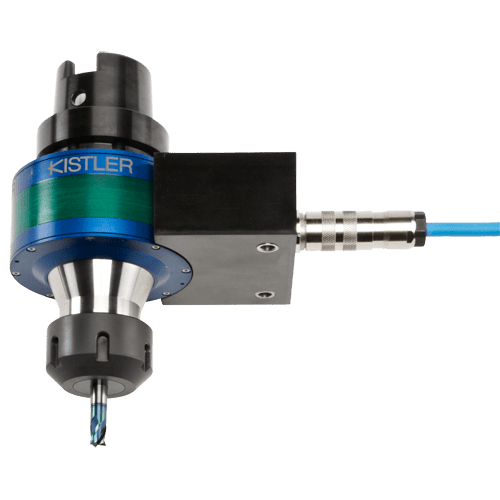 A Kistler dynamometer with blue-green cylindrical body and black base.