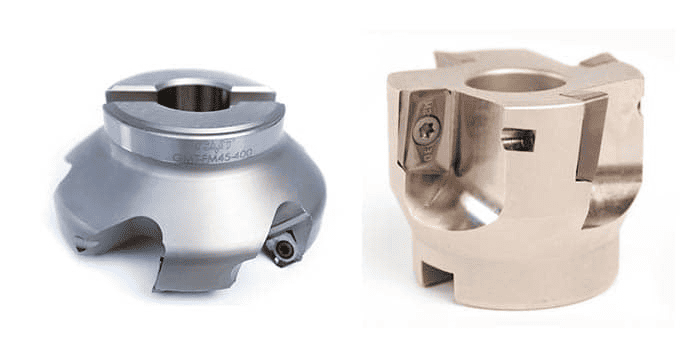 Silver metal object with circular opening at top and two flat surfaces, featuring small holes in each side.