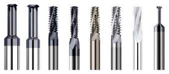 Metal cutting tools with spiral flutes in various sizes.