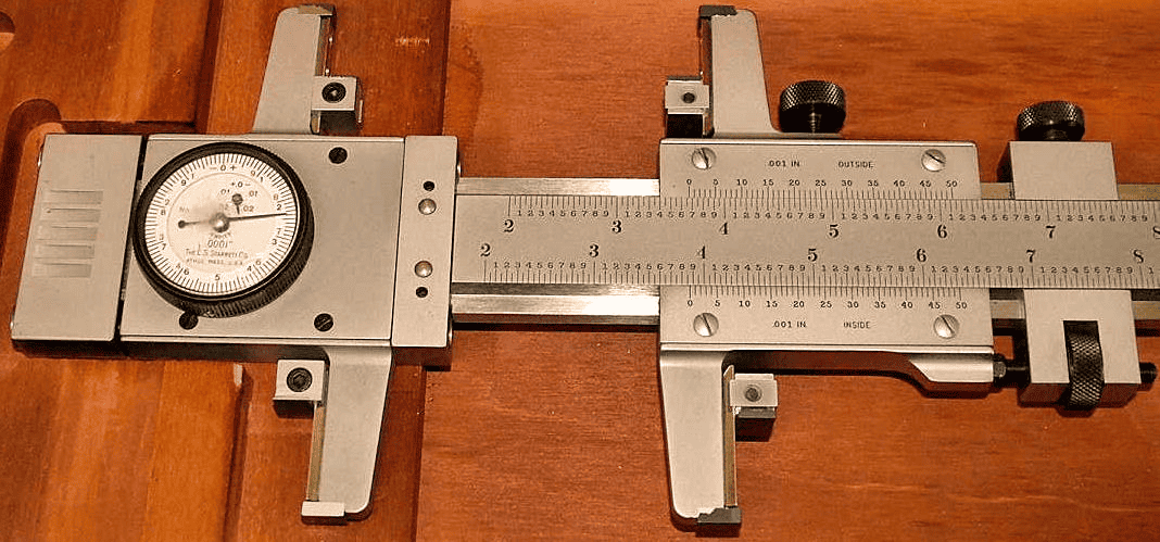 Precision measurement tool with vernier scale and calibrated markings.