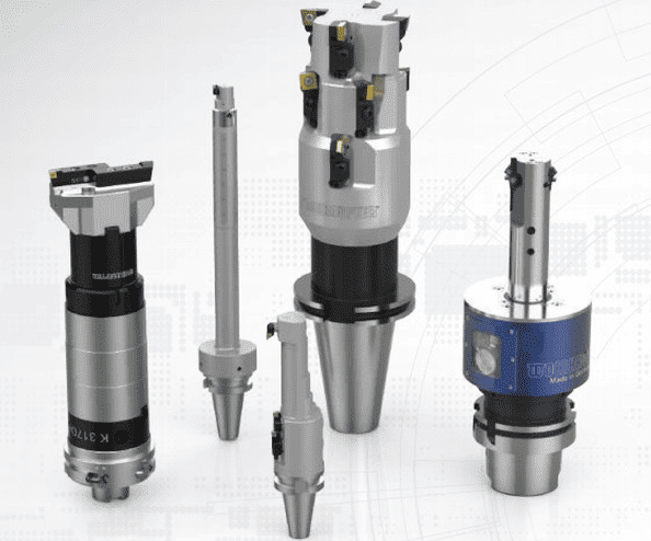 Four industrial tools with metallic finishes in a row from left to right.