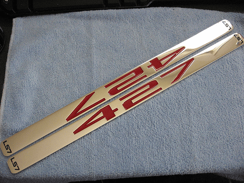 Metallic sign with red text: VISIA.