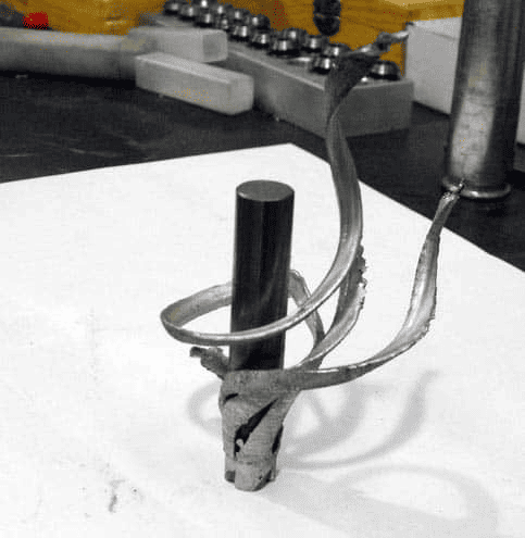 Antique metal sword hilt handle with intricate details.