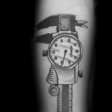 A black and white photo of a tattoo featuring a Mitutoyo dial caliper with open jaws.