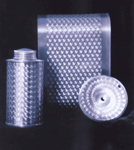 Textured cylinder with diamond pattern and small hole.