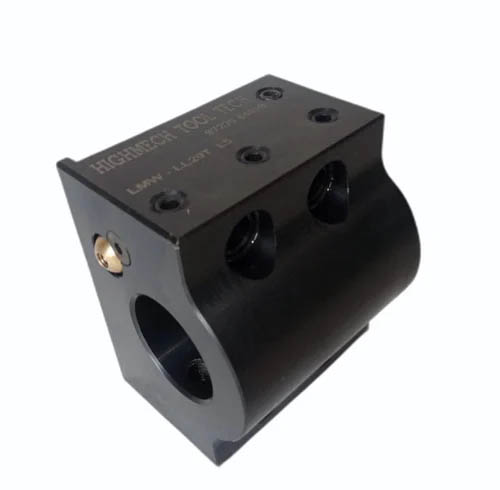 Black plastic or metal part with "HIGH TECH TOOLS" engraving, two holes, small hole and large cylindrical opening.